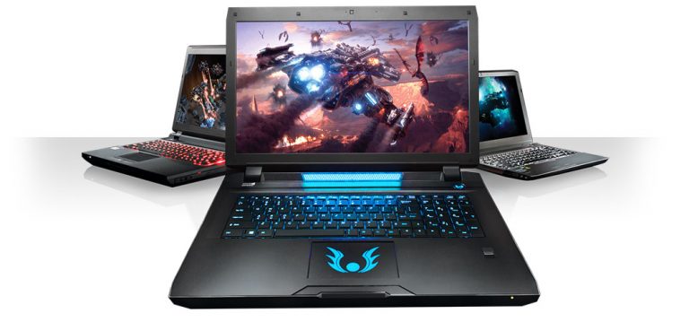 Multiple gaming laptops with RGB-lit keyboards and vibrant screens on display