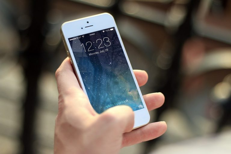 Front view of an Apple iPhone with screen on display on a white background