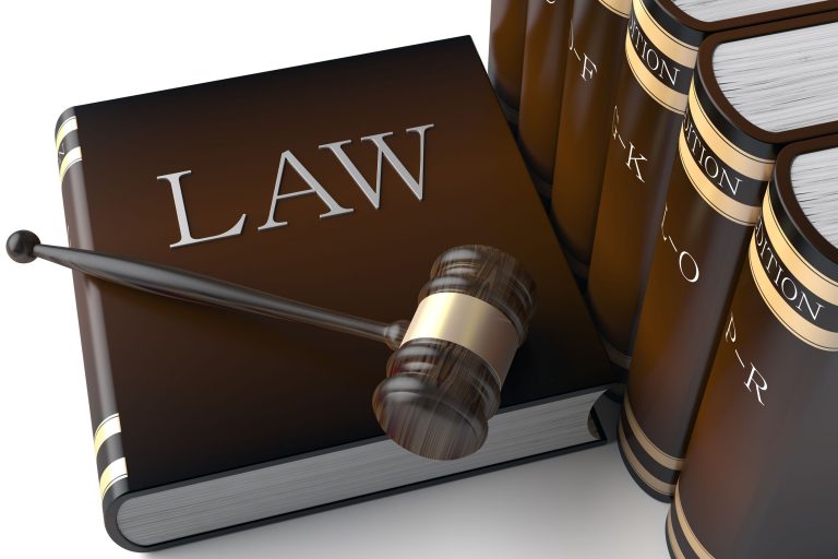 A person reviewing documents and considering options while selecting a lawyer.