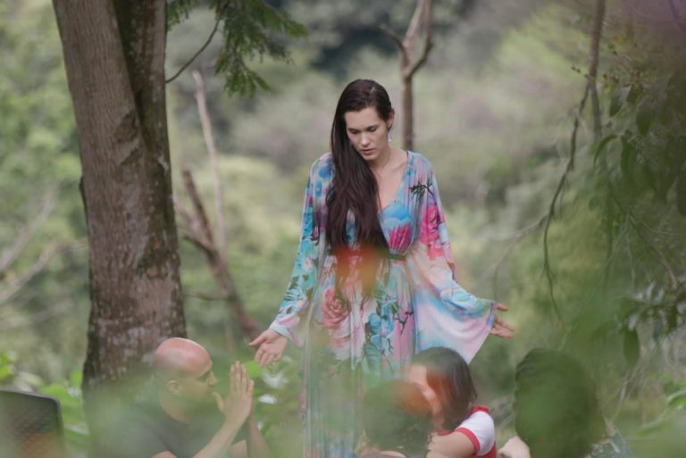 Screenshot showing Teal Swan in a teaching setting with text on reality acceptance