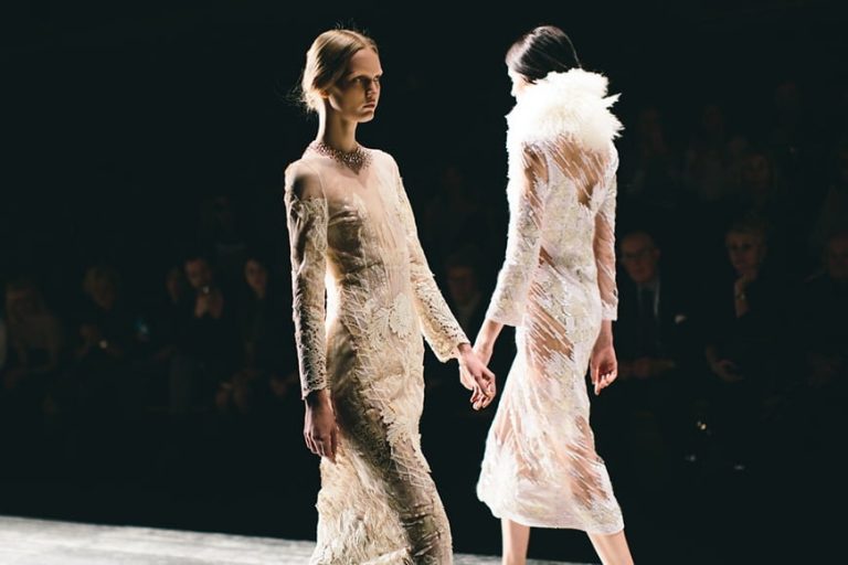 Photographer Bruce Weber capturing fashion models on a runway with natural lighting.