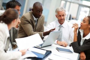A diverse group of professionals working together in a modern office meeting