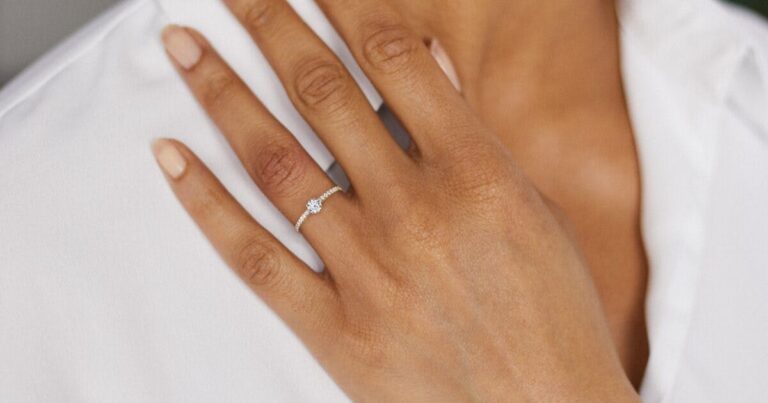 A delicate 0.3ct diamond engagement ring set in intricate gold, inspired by Indian royal designs.
