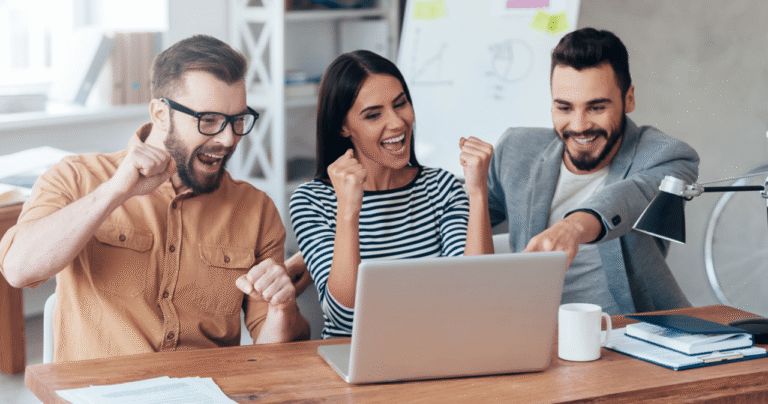 A group of tech professionals discussing forex trading on digital devices in a modern office.